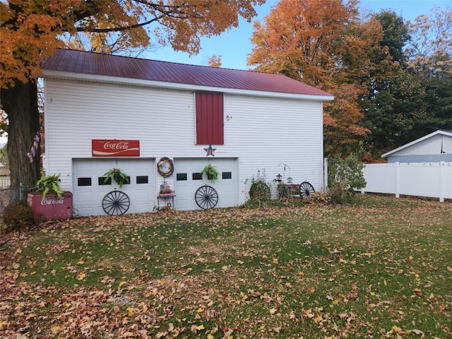 view of side of home featuring a lawn