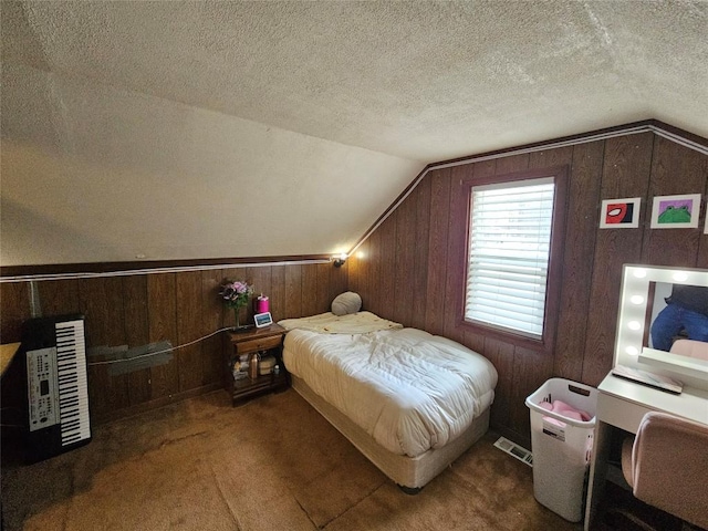 carpeted bedroom featuring lofted ceiling and a textured ceiling