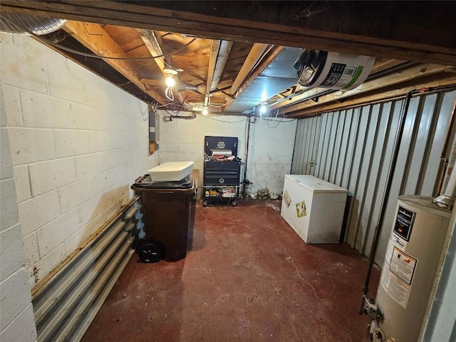 basement with gas water heater, electric panel, and refrigerator