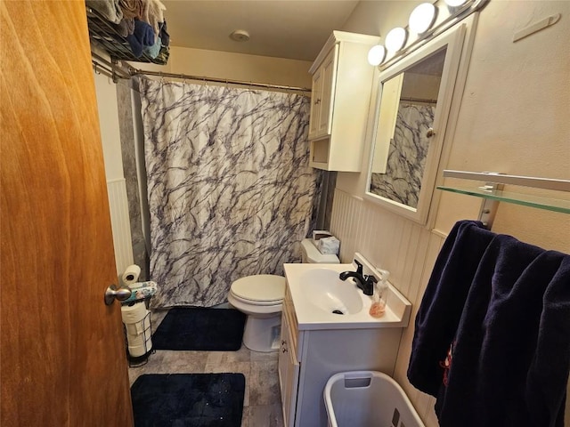 bathroom with vanity, hardwood / wood-style flooring, curtained shower, and toilet