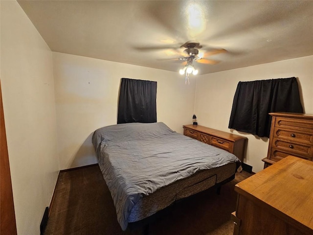 bedroom with dark carpet and ceiling fan