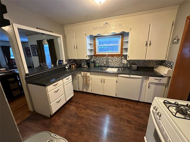 kitchen with white appliances, backsplash, dark wood-type flooring, sink, and white cabinetry