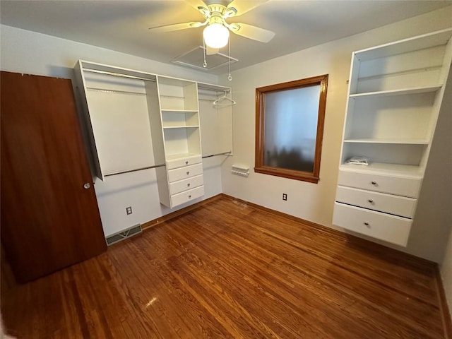 unfurnished bedroom featuring dark hardwood / wood-style floors and ceiling fan