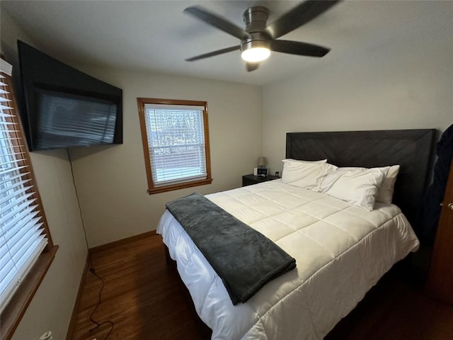 bedroom featuring ceiling fan and dark wood-type flooring