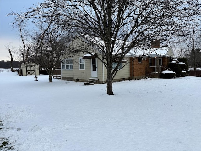 exterior space with a storage shed