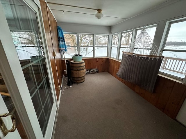 sunroom / solarium featuring a healthy amount of sunlight