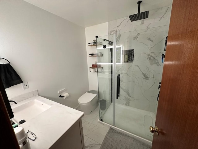 bathroom featuring vanity, an enclosed shower, and toilet