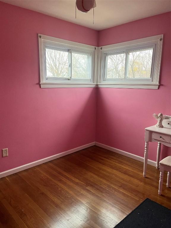 unfurnished dining area featuring wood-type flooring