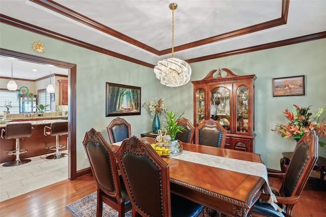 5640 Bear Run Cir, Fairview, PA 16415 - dining area featuring wood-type flooring, crown molding, a chandelier, a tray ceiling, and baseboards