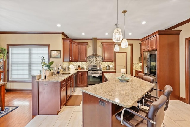5640 Bear Run Cir, Fairview, PA 16415 - kitchen featuring stainless steel gas range, wall chimney range hood, a sink, a kitchen island, and a kitchen breakfast bar