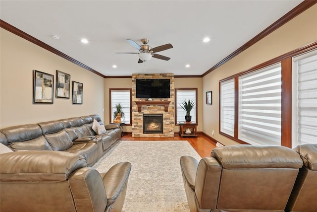 5640 Bear Run Cir, Fairview, PA 16415 - living area with wood finished floors, a ceiling fan, crown molding, recessed lighting, and a stone fireplace