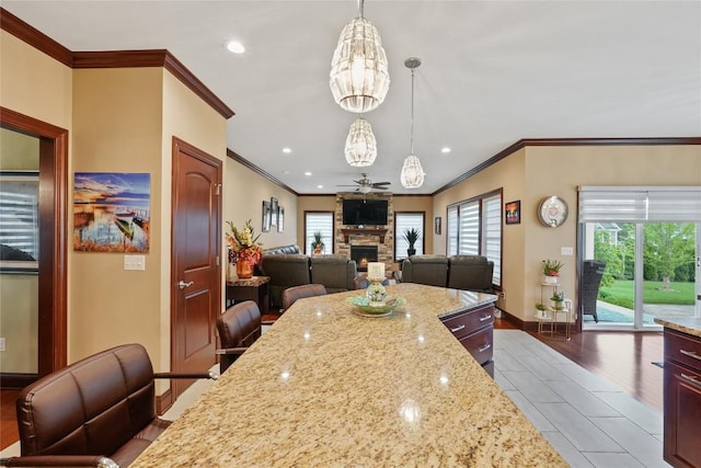 5640 Bear Run Cir, Fairview, PA 16415 - dining room with crown molding, a chandelier, a fireplace, plenty of natural light, and baseboards