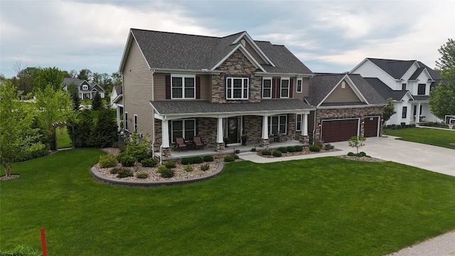 5640 Bear Run Cir, Fairview, PA 16415 - craftsman-style home featuring stone siding, covered porch, a garage, concrete driveway, and a front lawn