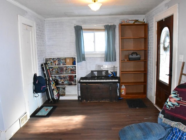 interior space featuring dark hardwood / wood-style flooring and crown molding