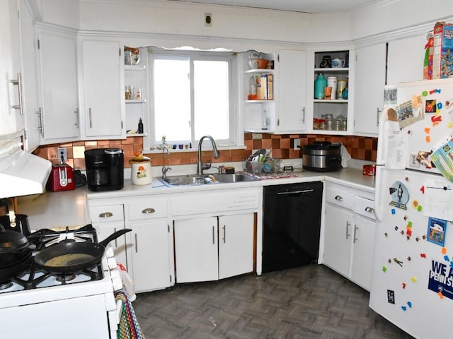 kitchen featuring sink, white appliances, and white cabinetry