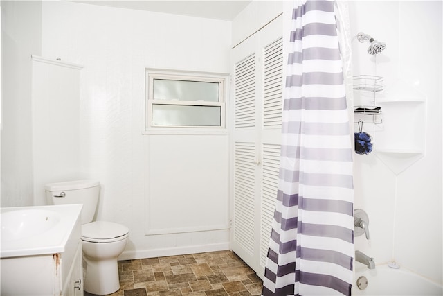 212 Main St, Jamestown, PA 16134 - bathroom featuring stone finish floors, vanity, shower / bathtub combination with curtain, and a closet