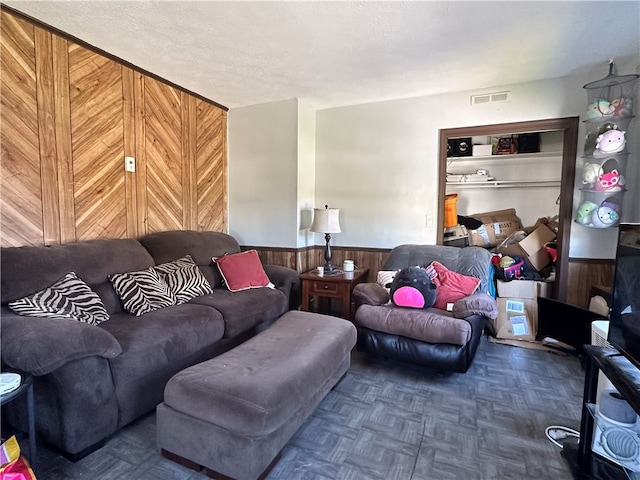 212 Main St, Jamestown, PA 16134 - living room featuring wooden walls and a wainscoted wall