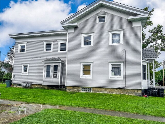 212 Main St, Jamestown, PA 16134 - rear view of property featuring a lawn