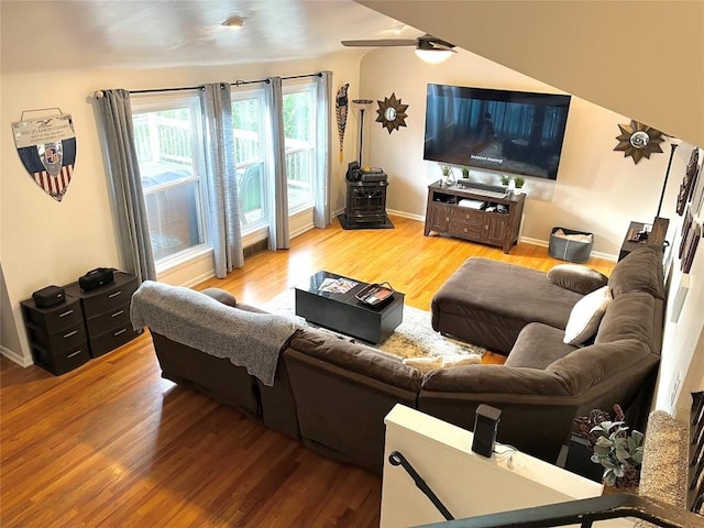 living room featuring hardwood / wood-style flooring and ceiling fan