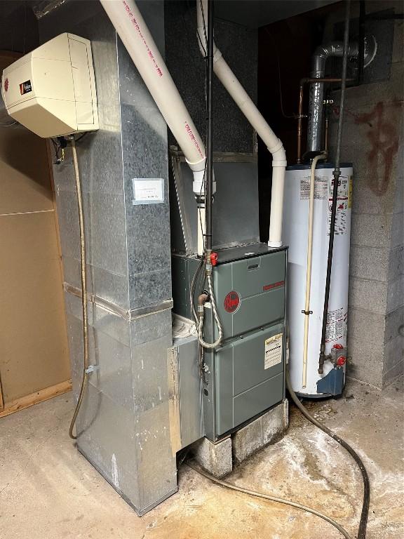 utility room with gas water heater