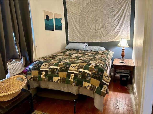 bedroom with dark wood-type flooring