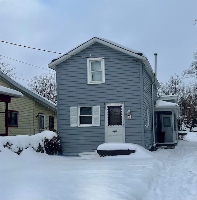 view of snow covered house