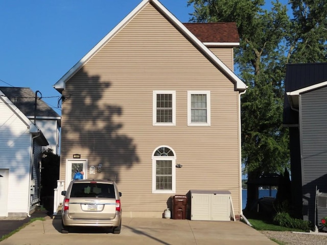 rear view of house with a garage