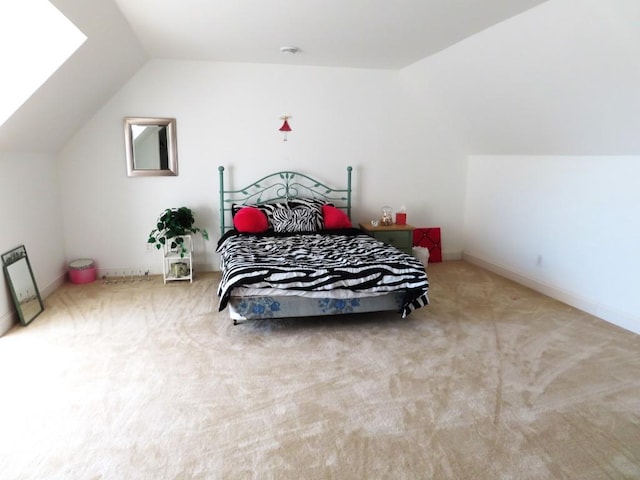 carpeted bedroom with vaulted ceiling