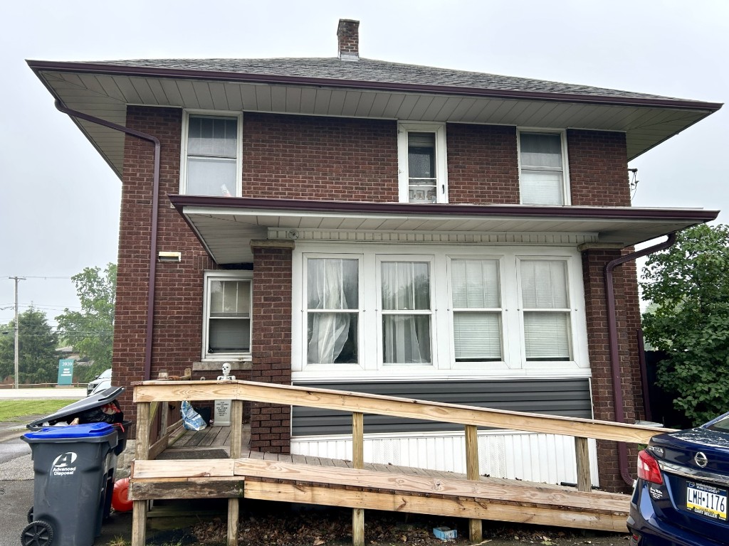 3942 W Ridge Rd, Erie, PA 16506 - view of front of home with brick siding and a wooden deck