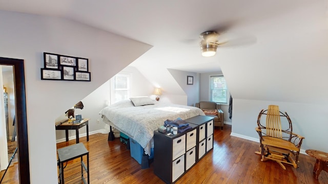 bedroom featuring wood-type flooring, ceiling fan, and lofted ceiling