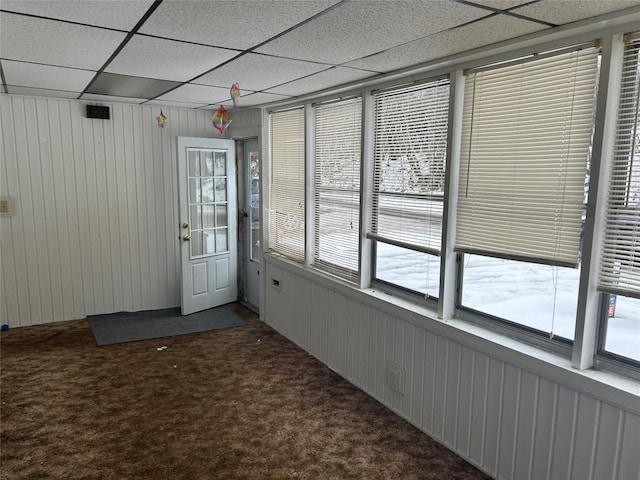 unfurnished sunroom featuring a paneled ceiling