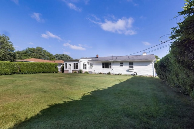 2548 E 32nd St, Erie, PA 16510 - rear view of property featuring a yard and a chimney