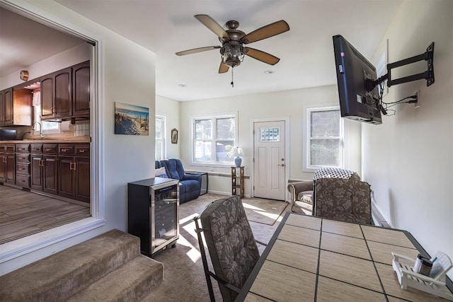 2548 E 32nd St, Erie, PA 16510 - dining space with wine cooler, a ceiling fan, and carpet