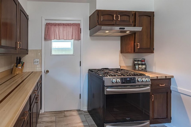 2548 E 32nd St, Erie, PA 16510 - kitchen with stainless steel gas stove, under cabinet range hood, dark brown cabinetry, and backsplash