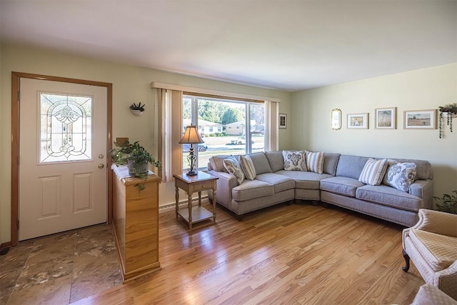 2548 E 32nd St, Erie, PA 16510 - living area with a baseboard radiator and light wood finished floors