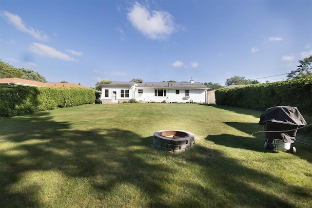 2548 E 32nd St, Erie, PA 16510 - rear view of property featuring an outdoor fire pit and a lawn