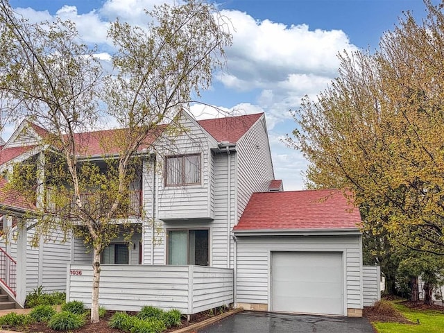 1036 Lookout Dr Unit 1036, Erie, PA 16507 - view of front of property with a garage, a shingled roof, and aphalt driveway