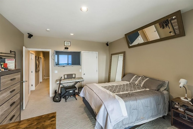 bedroom featuring baseboards, recessed lighting, and light colored carpet