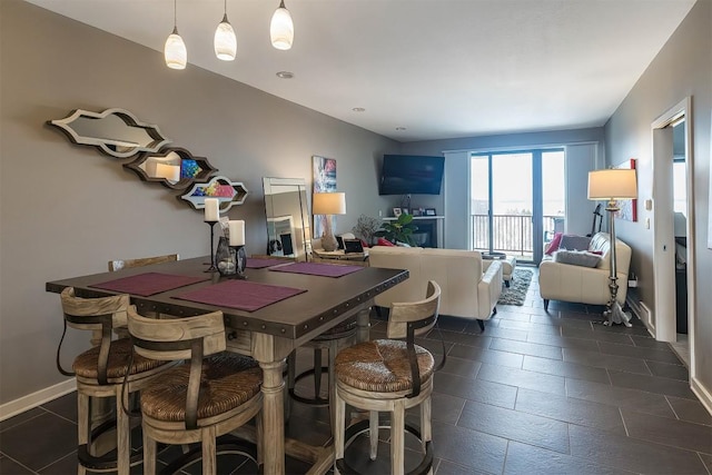 dining space featuring baseboards