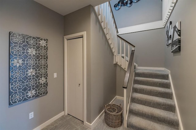 staircase with carpet and baseboards