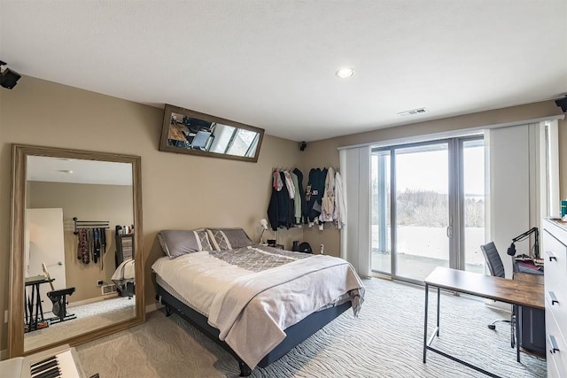 bedroom featuring access to exterior, visible vents, carpet floors, and baseboards