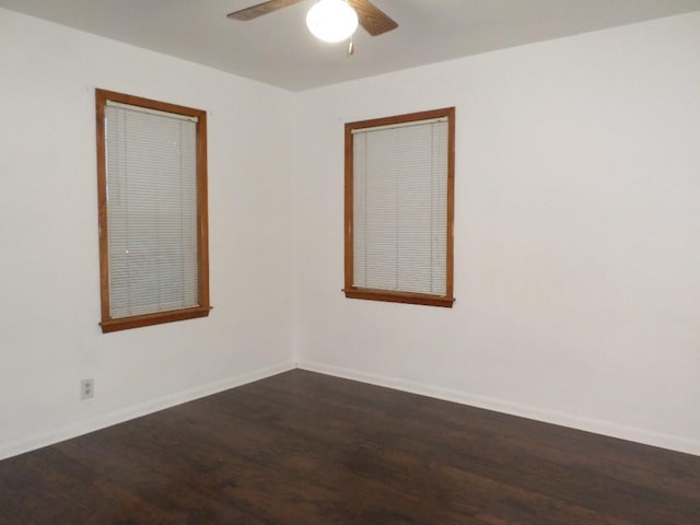 unfurnished room with dark wood-type flooring and ceiling fan