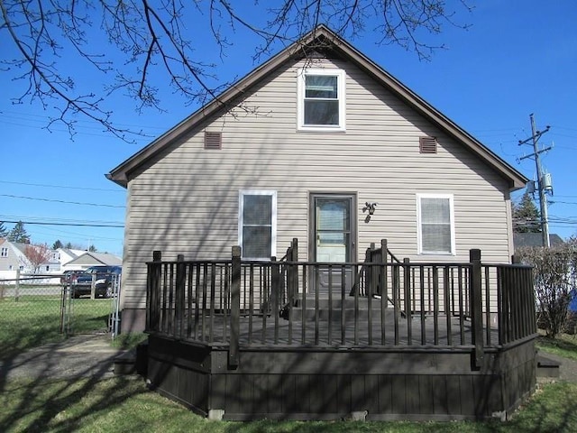 rear view of house featuring a deck