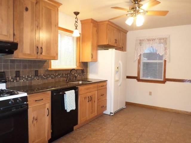 kitchen with pendant lighting, sink, decorative backsplash, black appliances, and light brown cabinets