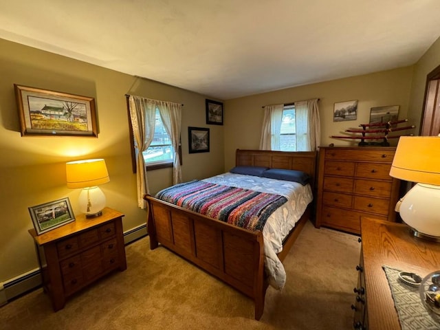 bedroom featuring light colored carpet and a baseboard heating unit