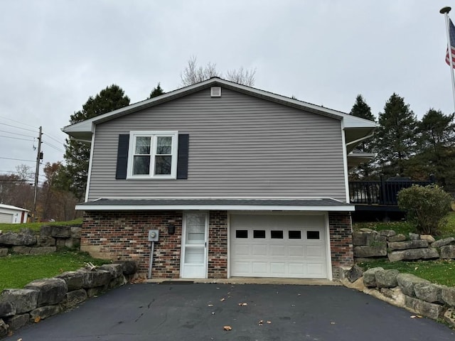 view of side of home with a garage