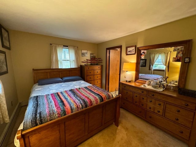 carpeted bedroom with a baseboard radiator and multiple windows