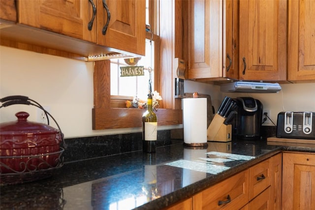 kitchen featuring dark stone counters