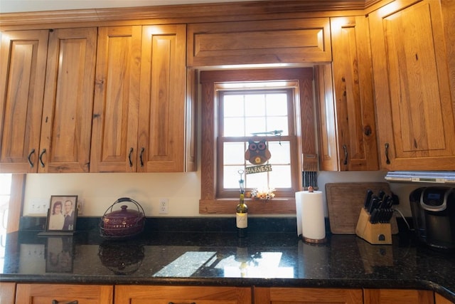 kitchen with dark stone countertops