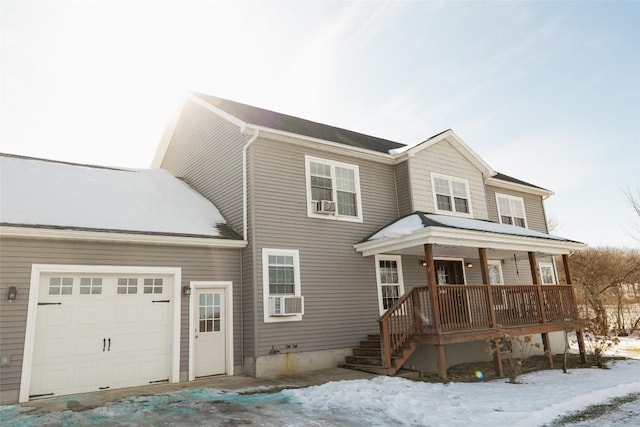 view of front of house featuring a garage and covered porch